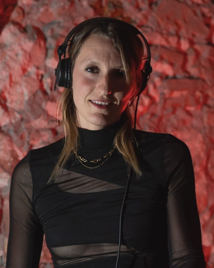 Portrait of Goutier, house DJ in Barcelona, wearing headphones